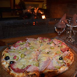 Pizza, to  the fireplace, at Au Bois Vert restaurant